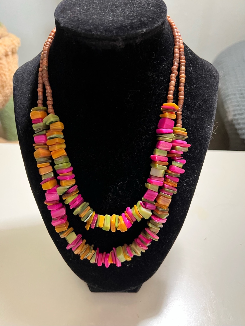 Vibrant multicolor shell beaded two strand necklace with toggle closure.